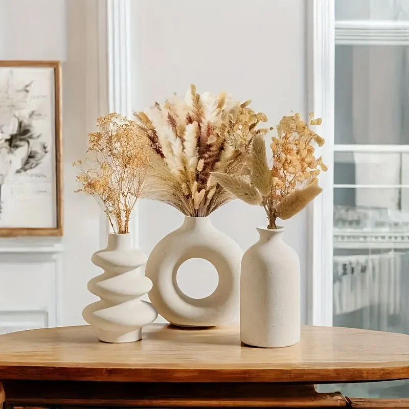 Trio vases céramique, vue de profil alignés